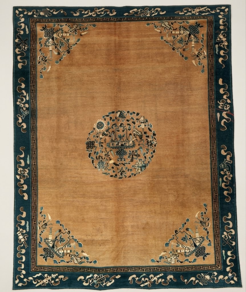 Chinese medallion rug end of 19th century with endless knot lotus and fish symbols and Taoist border