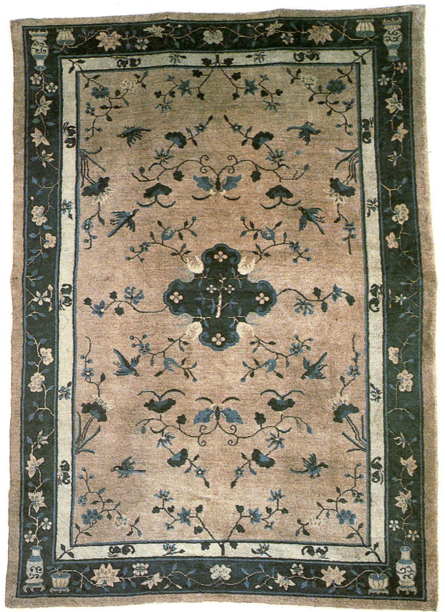 Chinese medallion rug with cruciform medallion blossoms butterflies and birds framed by peony and vase border