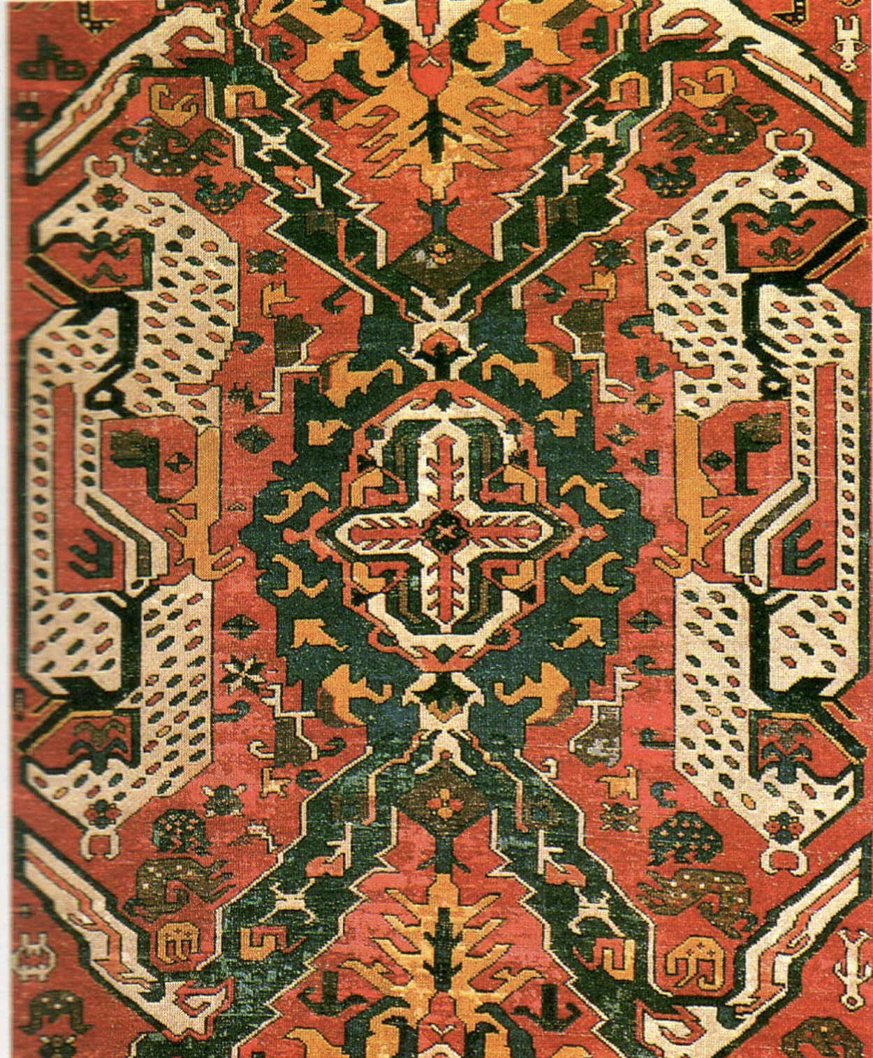 Mirrored dragon motifs facing one another in a Caucasian dragon rug field