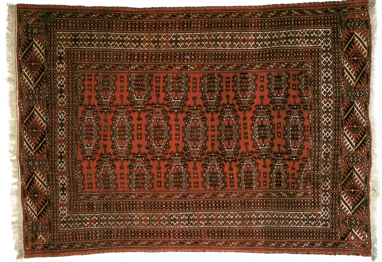 Prayer rug from Baluch, end of the 19th century, with a red field and tribal motifs