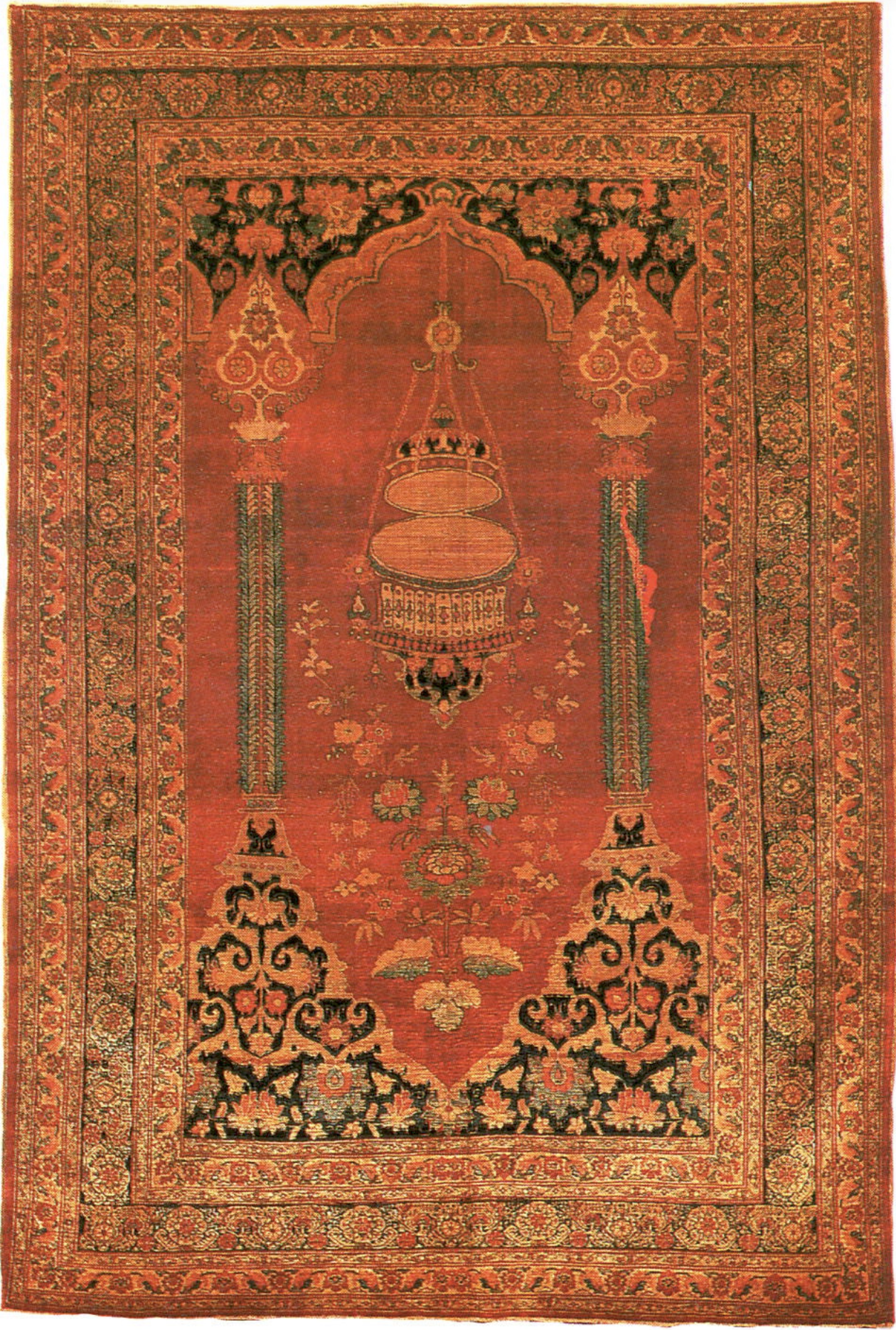 A Persian Heris prayer rug with the hanging lamp inside the columned mihrab niche
