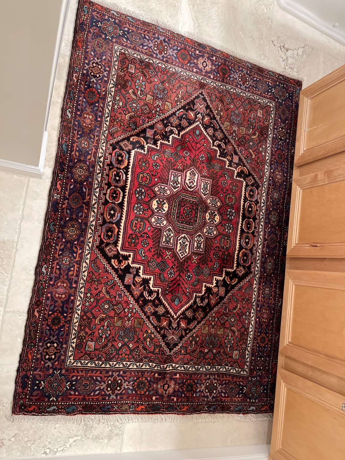Two handmade Persian rugs photographed at home by a five star Rugs.net customer
