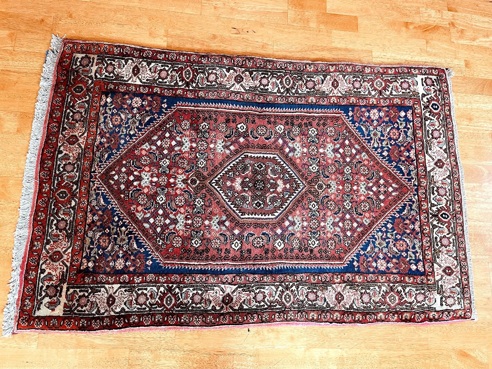 Authentic Persian rug photographed by a verified buyer praising quality and prompt delivery