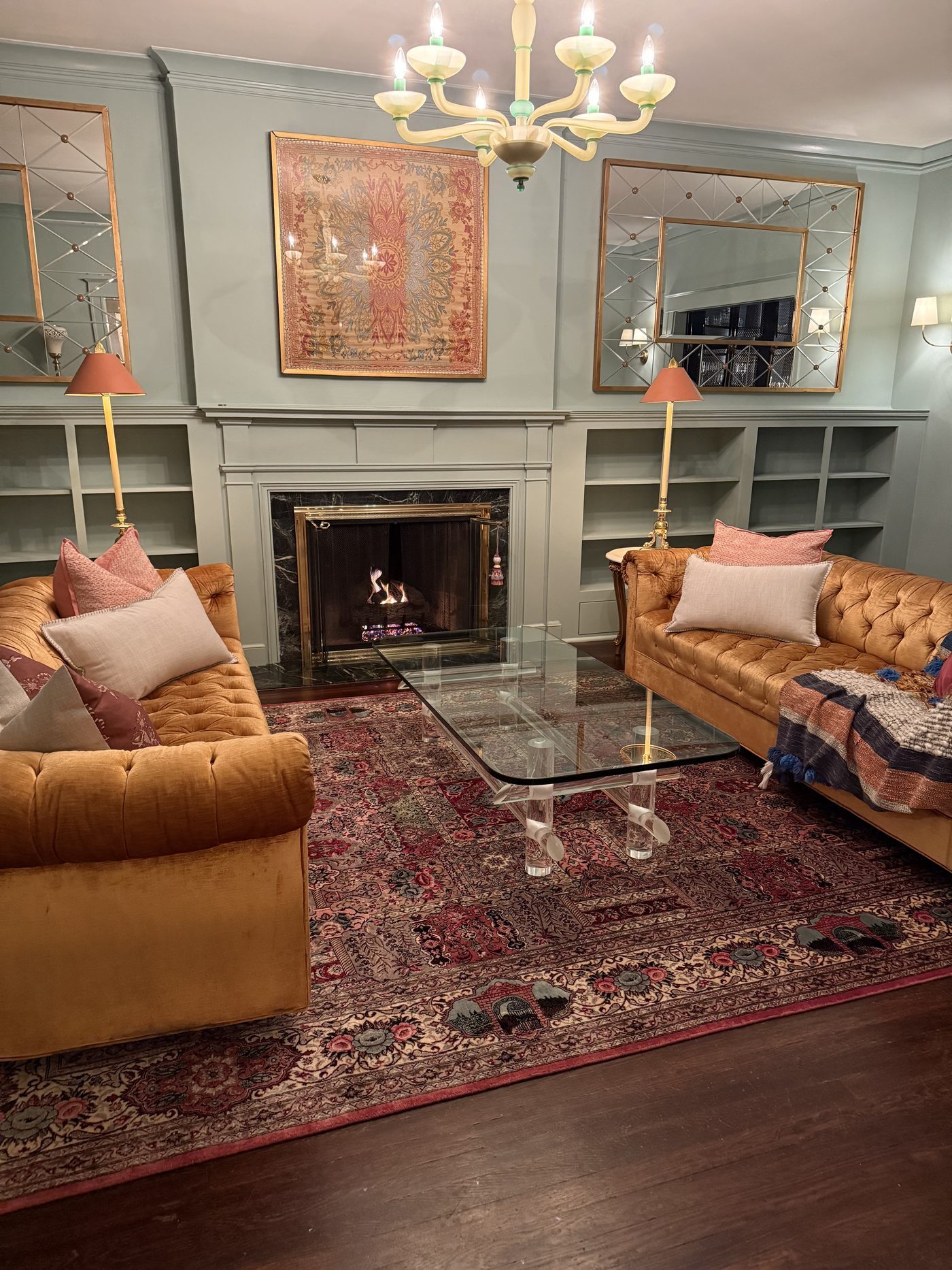 Persian rug white glove delivery and installation in a formal living room with fireplace ,  Rugs.net customer home New York