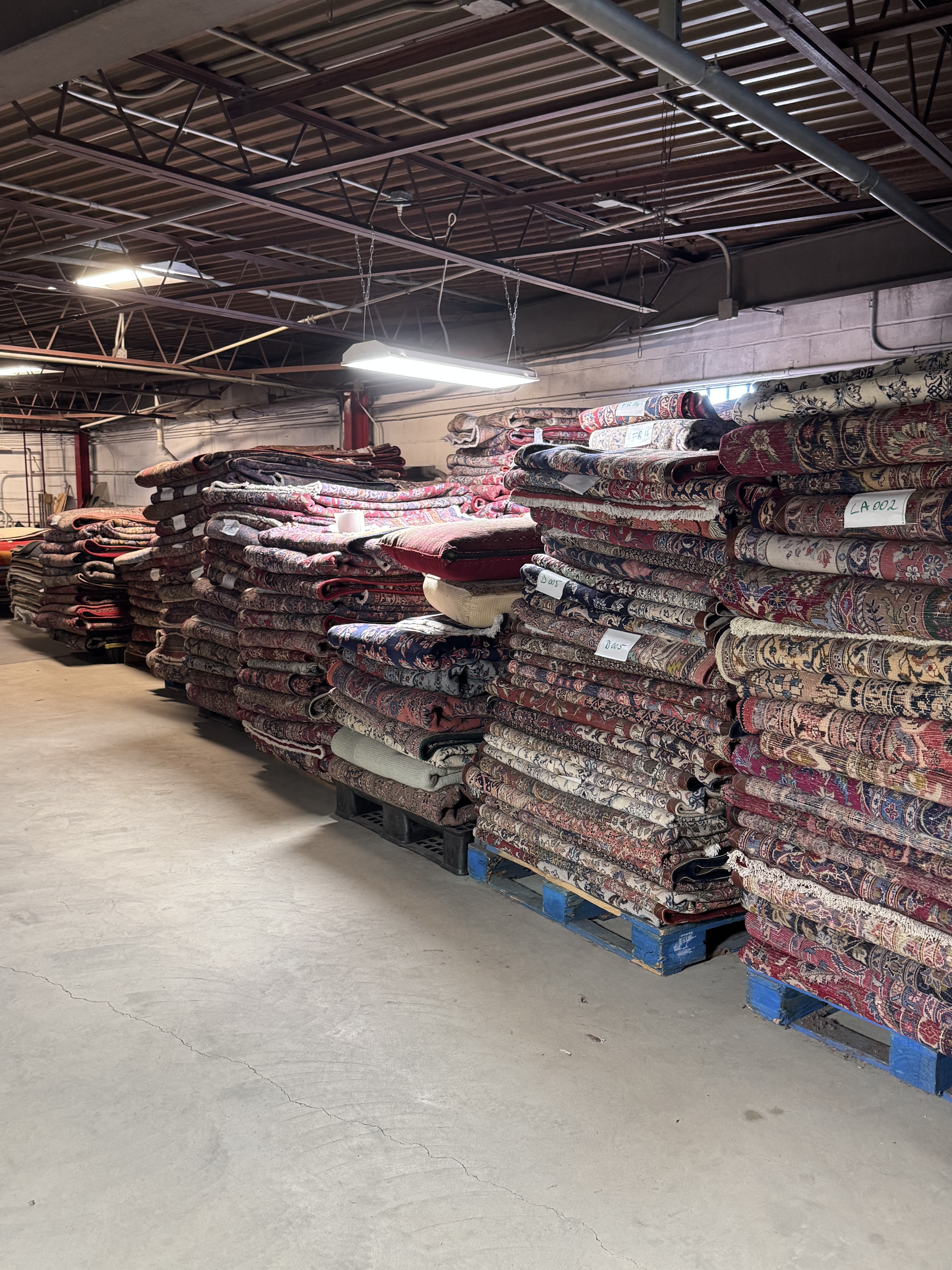 Pallets of imported rugs arriving at the Rugs.net warehouse ready for inspection