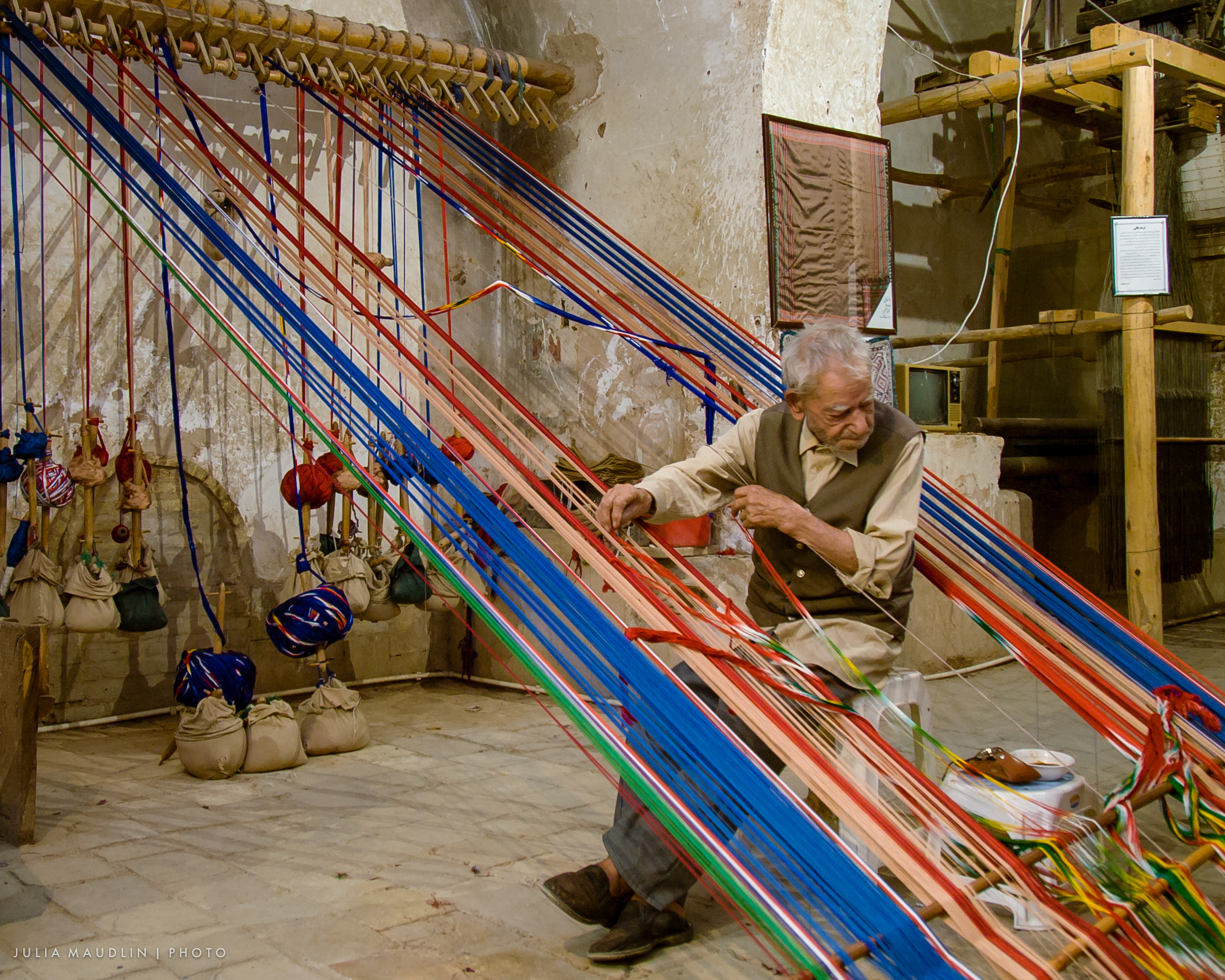Setting up the warp on a carpet loom in Yazd Iran
