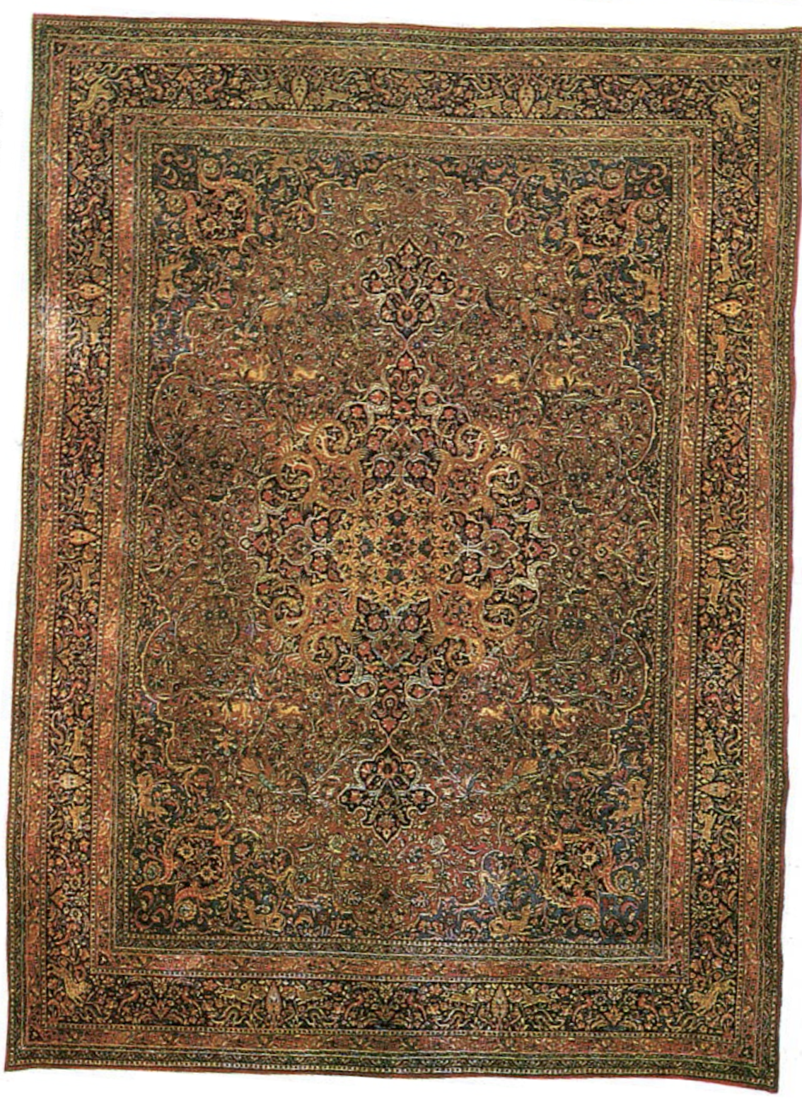 A classic Safavid style Persian medallion carpet with curvilinear arabesques and floral scrolls