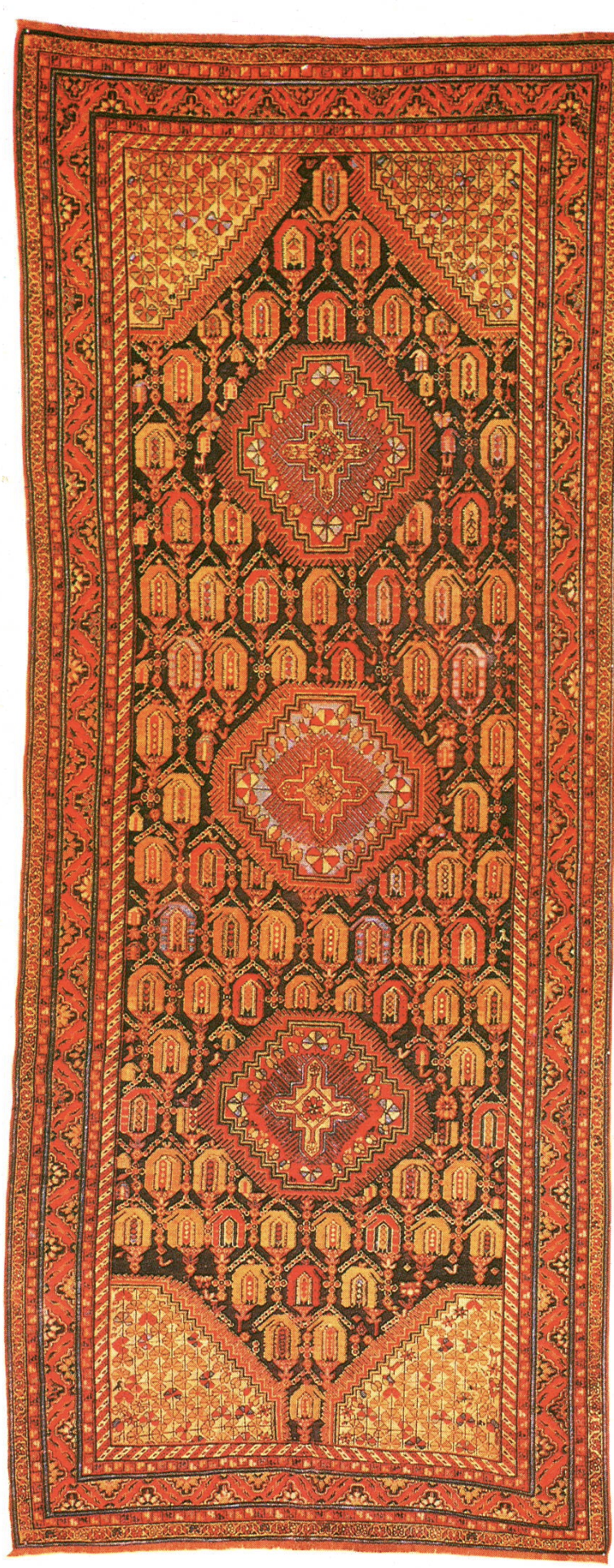 A Caucasian Tschila rug with three medallions on a blue ground strewn with botehs