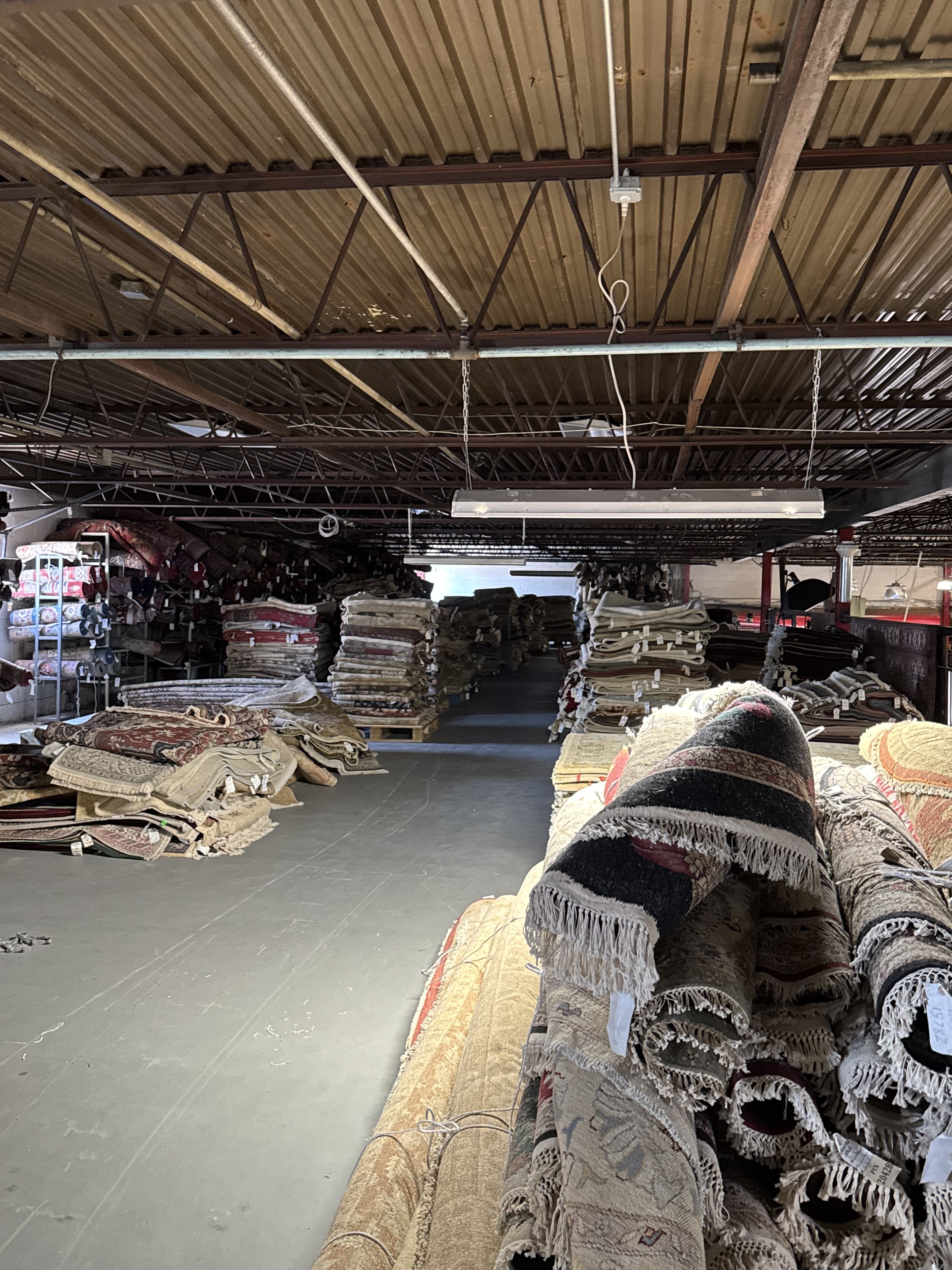 View from the upstairs level across the Rugs.net warehouse showing the scale of the collection