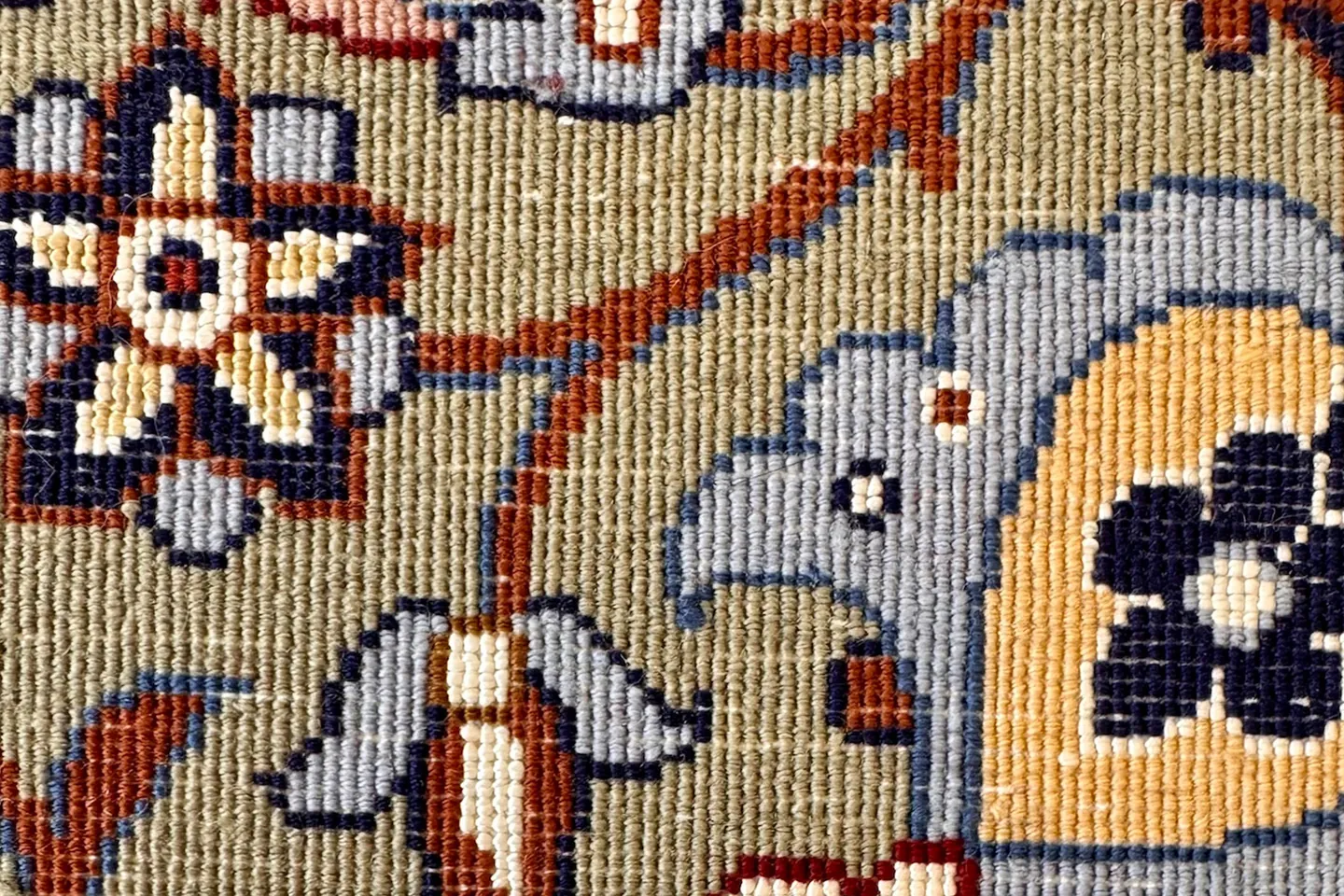 The reverse of a hand-knotted Persian rug, where every individual knot is visible as a single point of colour