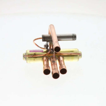 Copper HVAC refrigerant manifold assembly with multiple brazed copper tubes and capillary lines, refrigerant distribution component used in air conditioning and heat pump systems on white background