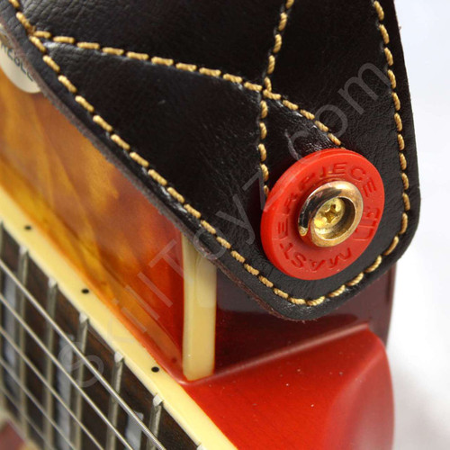 Red Guitar Strap Lock shown in use on an electric guitar. Helps secure your strap to your guitar.