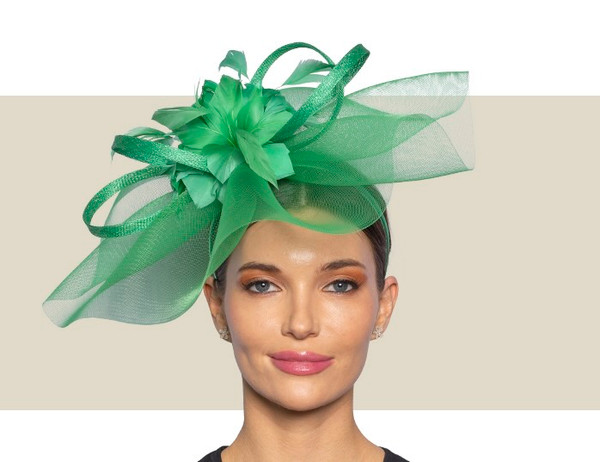 Wedding guest green fascinator with feather flower detail