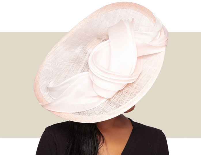 Elegant blush pink fascinator hat handmade in England by Whiteley Millinery