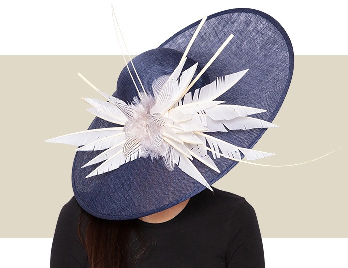 Wide brim Kentucky Derby hat in navy blue with dramatic ivory feather accents