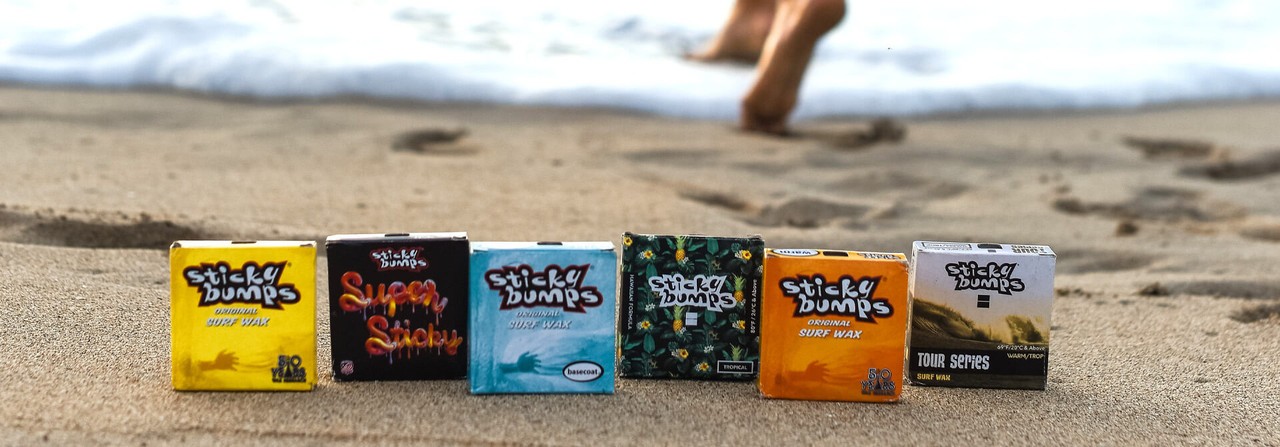 Free Shipping Over $25 ends 9/2. Image of bars of Sticky Bumps wax on a sandy beach. Free Shipping Over $25 ends 9/2. Image of bars of Sticky Bumps wax on a sandy beach.