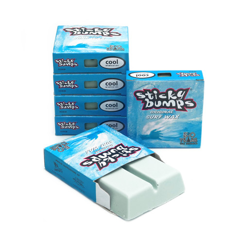 Six iconic blue boxes of Sticky Bumps Original Formula cool surf wax. 