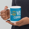 Love Coffee ceramic
mug, blue, hands