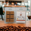 Hava Java House Blend wax melt clamshell on café counter with coffee beans in front