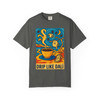 Drip Like Dalí – Surrealist Coffee Tee by Coo Coo’s Coffee in pepper grey, with bold surrealist artwork of coffee and clocks in a Dalí-inspired style.