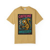Caffeine Obsessed – Squirrel Mode Activated Tee in mustard yellow, energetic squirrel design, by Coo Coo’s Coffee.