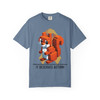 Flo blue tee with vibrant pixel squirrel art, golden ribbon, and “It Deserves Action” lettering – Childhood Cancer Awareness Tee by Coo Coo’s Coffee.