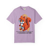 Orchid purple tee featuring a pixelated squirrel design with coffee cup, gold ribbon tribute, and “It Deserves Action” slogan – Childhood Cancer Awareness Tee by Coo Coo’s Coffee.