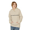 Sand-colored Childhood Cancer Tribute Hoodie by Coo Coo’s Coffee, featuring pixel squirrel design and “Let’s Be the Action” slogan for awareness and support. female model front graphic