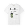 White “Think Later Tee – Brew Mode Activated” by Coo Coo’s Coffee with frazzled Bert gecko and slogan “Brew First Think Later.”