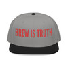 Black/Gray/Gray Snapback Hat – Brew Is Truth embroidery in bold red on black crown with gray visor, urban coffee culture snapback by Coo Coo’s Coffee.