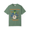 Light Green tee featuring gecko drummer illustration and playful headline—fresh stage look