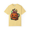 “Butter yellow tee showing pumpkin coffee mug illustration with purple steam, bats, and star anise, Pumpkin Mug Tee by Coo Coo’s Coffee.”