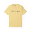 "Coffee Life – Daily Drip Tee in Butter yellow by Coo Coo’s Coffee. Classic simple coffee shirt with bold text, soft cotton, relaxed fit for everyday wear."