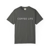 "Coffee Life – Daily Drip Tee in Pepper grey by Coo Coo’s Coffee. Modern coffee-themed shirt with minimalist lettering, unisex garment-dyed cotton tee."