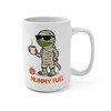 Front view of 15 oz white ceramic coffee mug with Bert the gecko wrapped like a mummy, wearing sunglasses and holding a coffee cup above the text “MUMMY FUEL”.