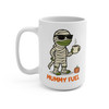 Front view of 15 oz white ceramic coffee mug with Bert the gecko wrapped like a mummy, wearing sunglasses and holding a coffee cup above the text “MUMMY FUEL”.