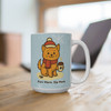 Purr More Sip More kitty mug on a wooden table near a laptop, styled as a cozy holiday coffee moment for cat lovers.