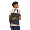 Model carrying black tote showing For Jaxen For Every Kid message on back