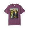 The Americano Gothic coffee tee — two geckos posed as the couple from Grant Wood's American Gothic in front of a white gothic-window farmhouse; Bert in sunglasses holding a pitchfork, Gertie in pearls beside him, with "The Americano Gothic" and a red Florida Brew Crew line beneath — Coo Coo's Coffee Brew Good Vibes garment-dyed Comfort Colors art parody tee.