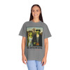 The Americano Gothic coffee tee — two geckos posed as the couple from Grant Wood's American Gothic in front of a white gothic-window farmhouse; Bert in sunglasses holding a pitchfork, Gertie in pearls beside him, with "The Americano Gothic" and a red Florida Brew Crew line beneath — Coo Coo's Coffee Brew Good Vibes garment-dyed Comfort Colors art parody tee.