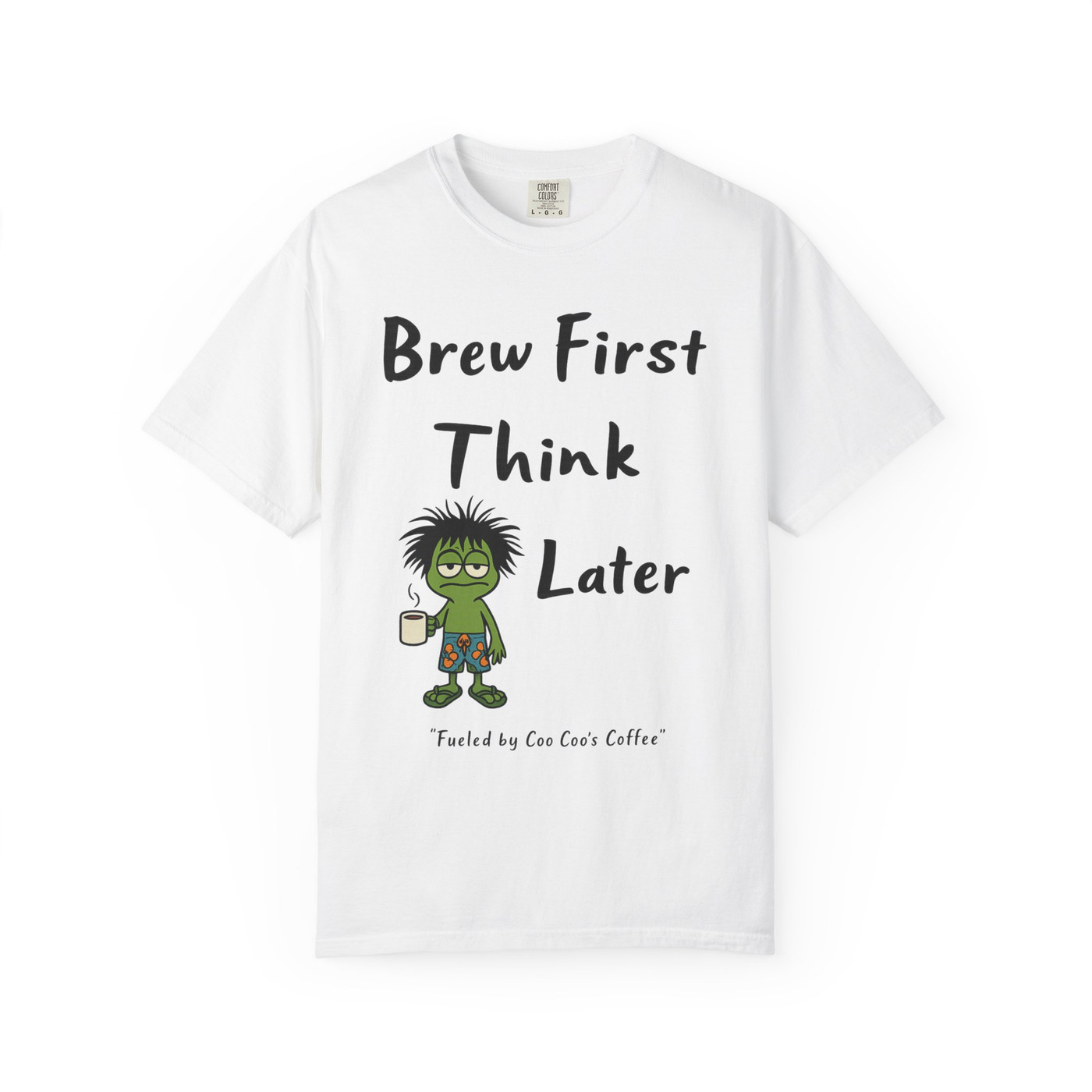 White “Think Later Tee – Brew Mode Activated” by Coo Coo’s Coffee with frazzled Bert gecko and slogan “Brew First Think Later.”
