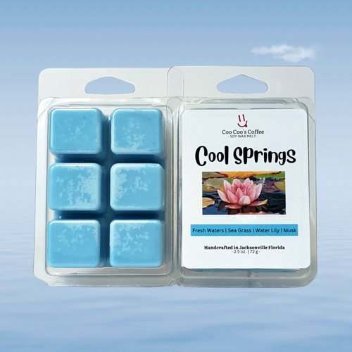 ool Springs wax melt package on a soft blue water background, symbolizing fresh waters scent.