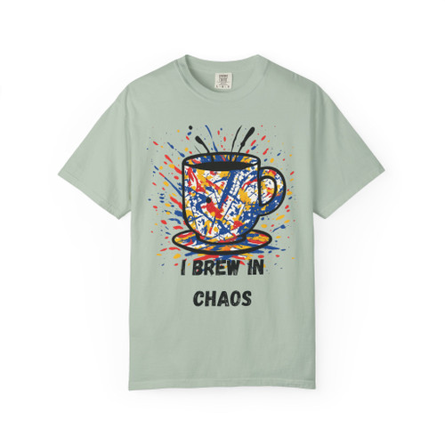 Chaos Brew Tee in Bay – cool green canvas with splatter coffee cup design, modern art-inspired shirt by Coo Coo’s Coffee.