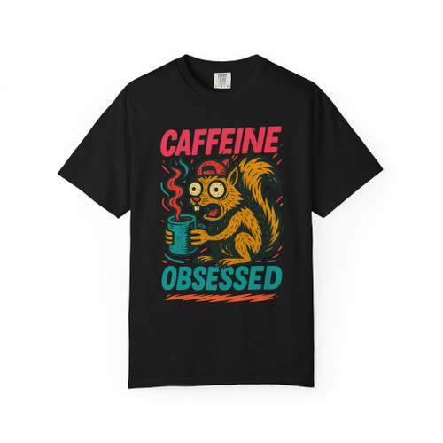 Black short-sleeve tee showcasing the “Caffeine Obsessed” squirrel illustration, with red and teal text popping against the dark background.