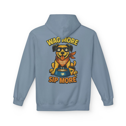 Stone blue hoodie featuring “Wag More, Sip More” Coffee Pup design by Coo Coo’s Coffee, cozy unisex hoodie with cheerful coffee dog illustration.