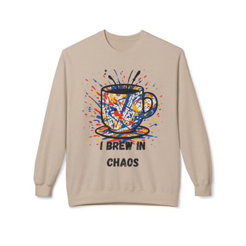 Sand-colored sweatshirt with vibrant abstract coffee cup design and “I Brew in Chaos” slogan – Brew in Chaos sweatshirt by Coo Coo’s Coffee.