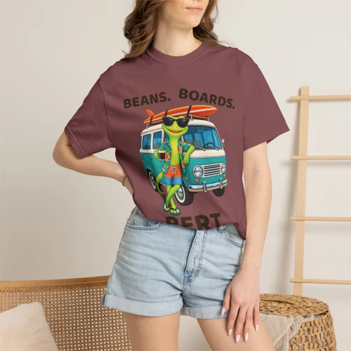 Close-up of the surf gecko Bert with a retro aqua camper van and longboard graphic print on the Beans. Boards. Bert. t-shirt, brick