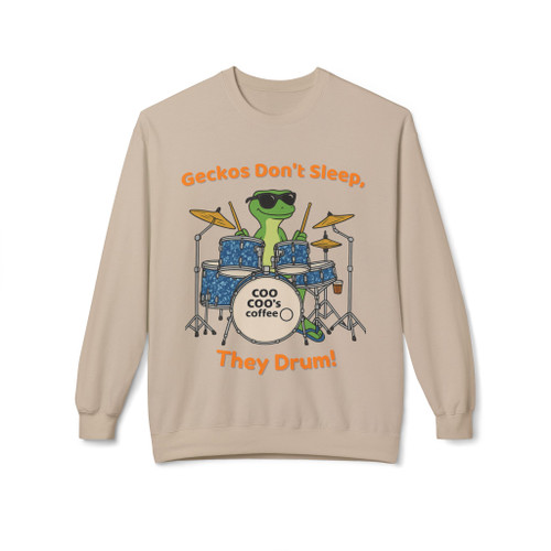 Sand fleece crewneck with gecko drummer graphic and “Geckos Don’t Sleep, They Drum!” text—Coo Coo’s Coffee roaster tour vibe.