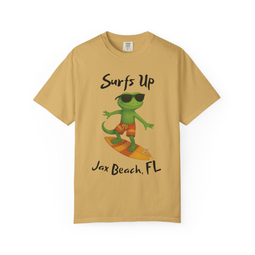 Mustard yellow short-sleeve tee with Bert the gecko in sunglasses surfing, “Surfs Up – Jax Beach, FL” text, Bert’s Surf Club – Jax Beach Tee by Coo Coo’s Coffee.