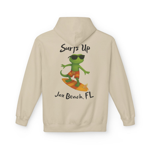 "Sand-colored hoodie featuring Bert the gecko surfing on an orange board with text 'Surf’s Up – Jax Beach, FL' by Coo Coo’s Coffee."